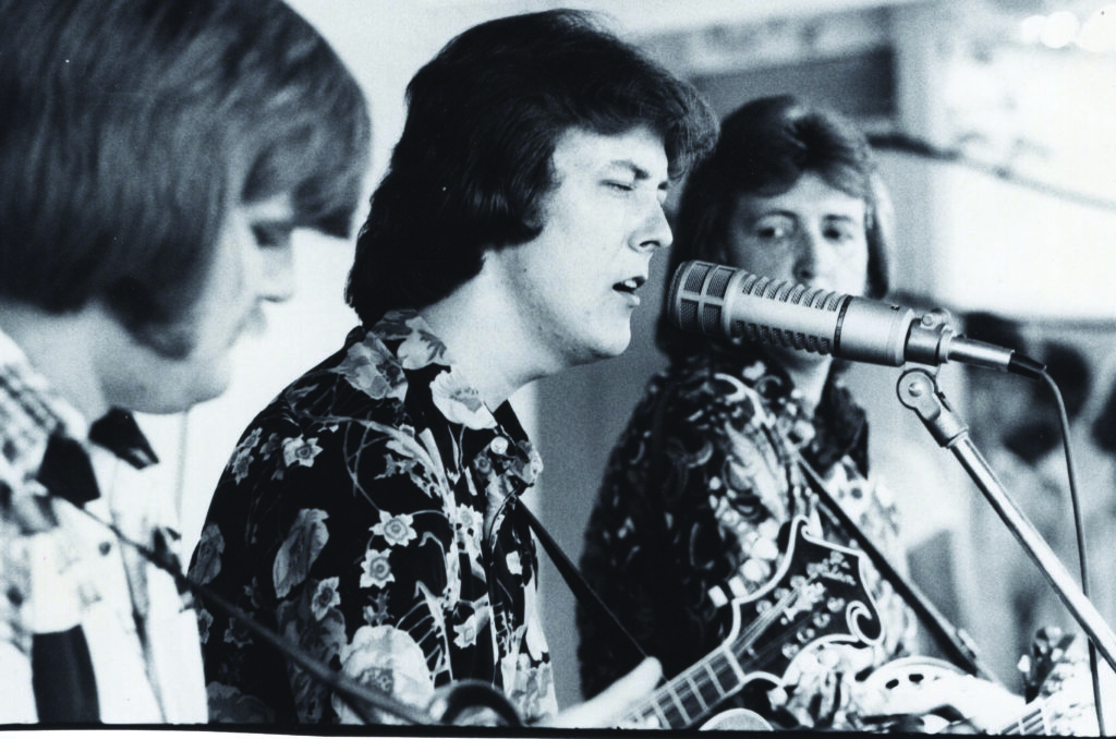 Ricky Skaggs, Tony Rice, and JD Crowe performing on stage together