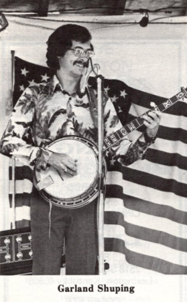 Black and white image of Garland Shuping playing the banjo.