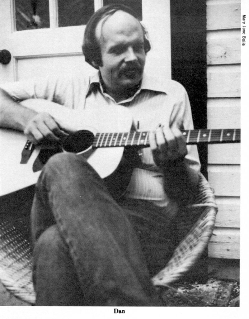 Dan relaxing outside playing his instrument