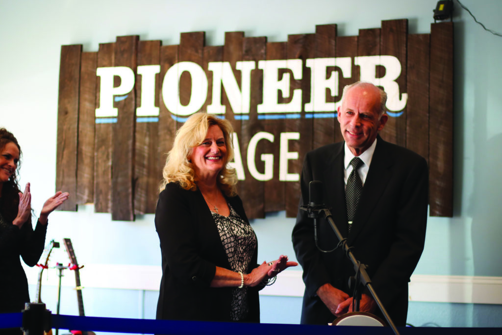 Mr. and Mrs. Eddie Stubbs speaking on the Pioneer Stage speaking to Glenville students and administration members and the community of Glenville on the day they dropped off Eddie’s archives. Photo Courtesy Glenville State College Public Relations