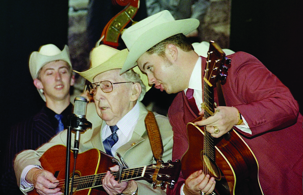 Kody Norris (right) and Alex Leach (left) perform with bluegrass pioneer Curly Seckler at the Paramount Center for the Arts in Bristol, TN in February 2009. Photo by Penny Parsons