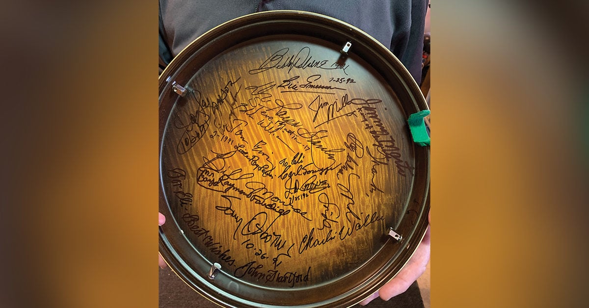 The collection of autographs on Eli Miller’s banjo resonator