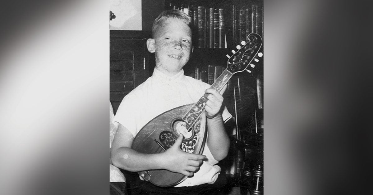 Tom Mindte with his first mandolin (age 8)